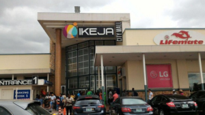 Ikeja City Mall is depicted in the image, showcasing its modern architecture and bustling atmosphere. With its sleek design and vibrant energy, it's a nice place to hangout in Ikeja for shopping, dining, and entertainment, offering a dynamic experience for visitors of all ages.